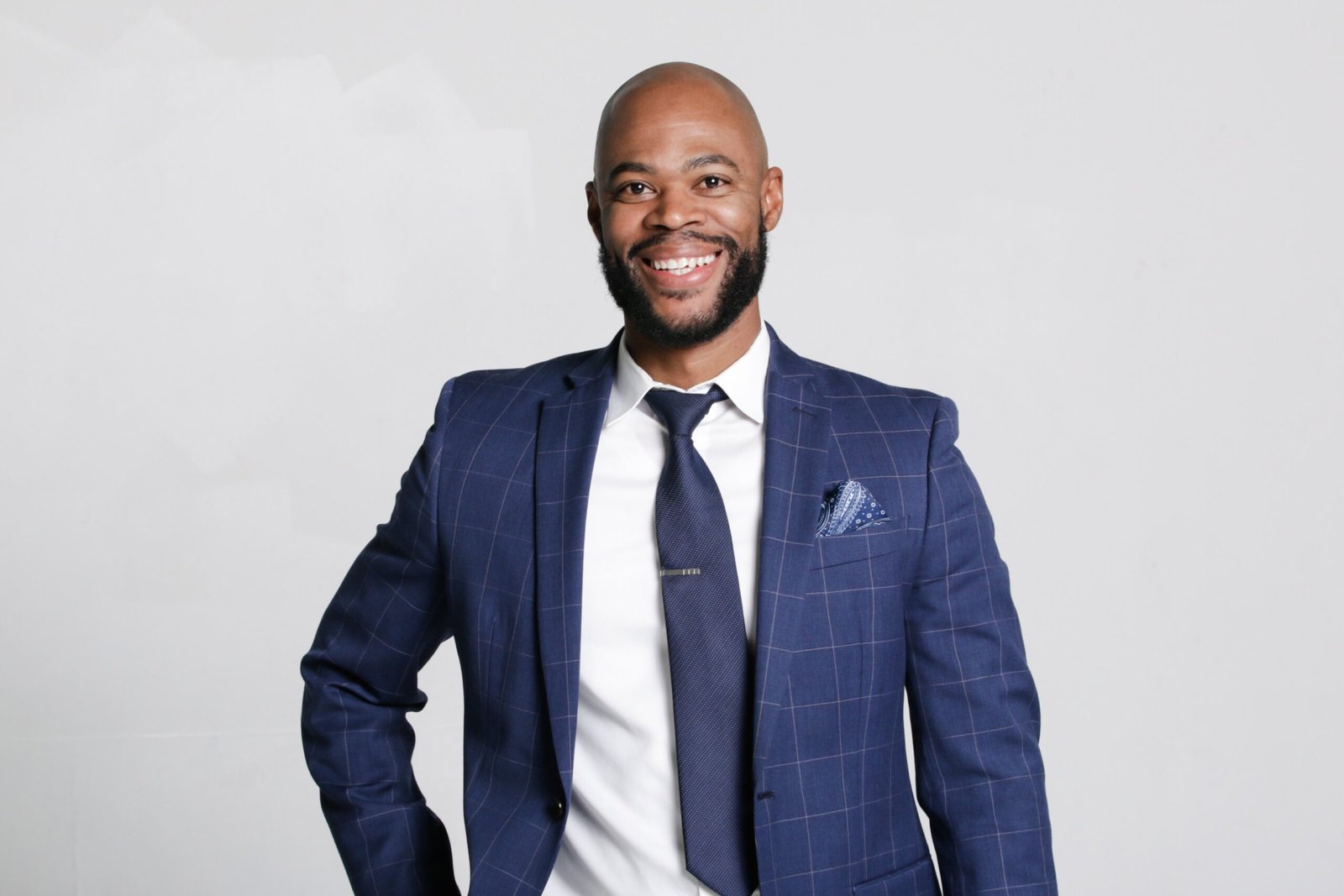 Guy Francois in a navy suit; portfolio property photo to be supplied